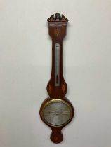 A 19th century mahogany and inlaid wheel barometer with silvered dial inscribed 'D. Luvatti,