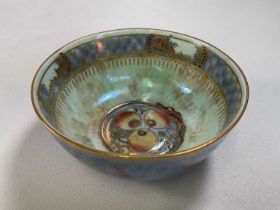 WEDGWOOD; a dragon lustre bowl internally painted with three fruit and externally with twin dragons,