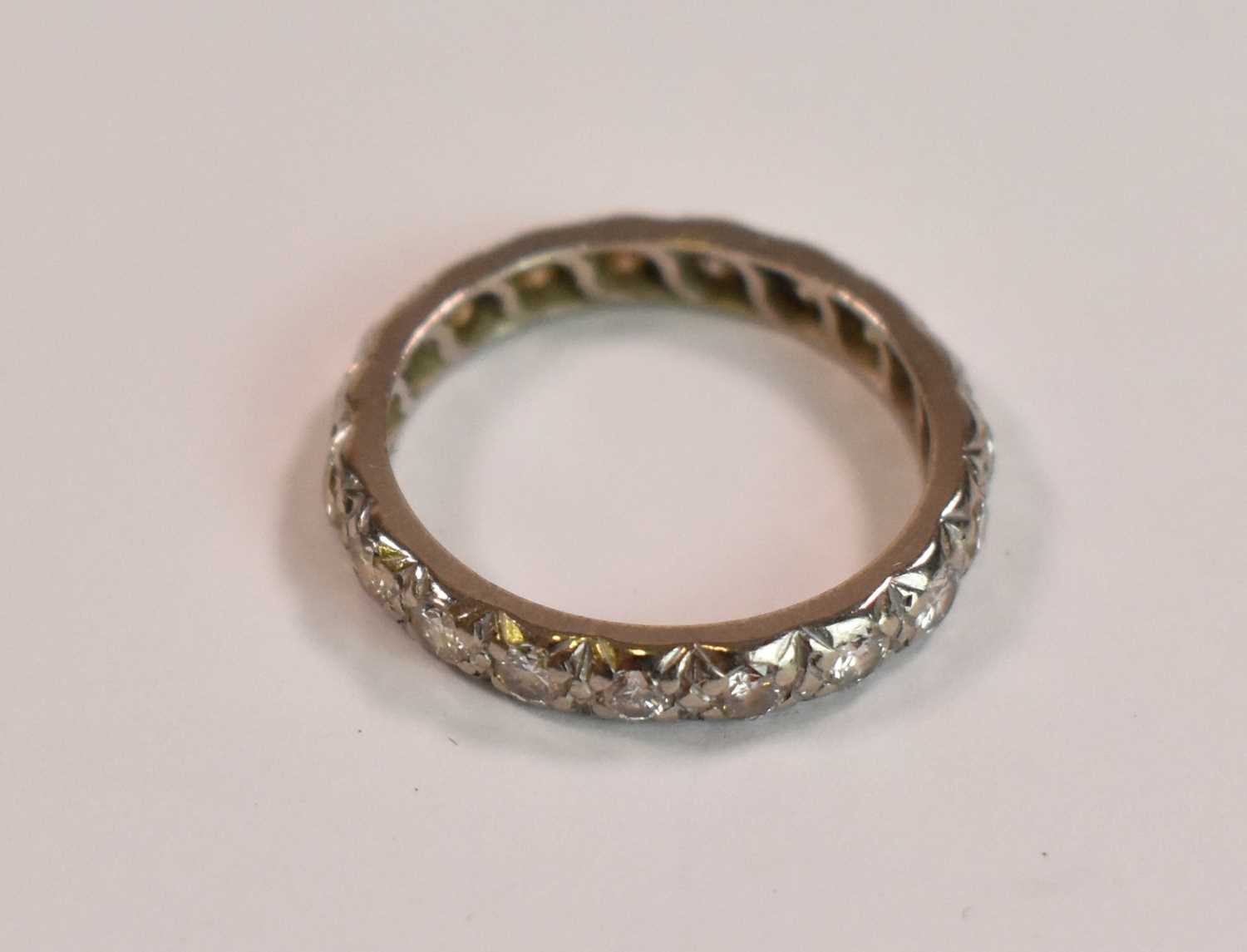 A white metal and diamond set full eternity ring, each round brilliant cut stone weighing approx 0. - Image 3 of 3