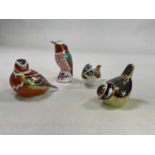 ROYAL CROWN DERBY; a collection of four bird paperweights including a Collectors' Guild Crested