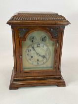 A large oak cased mantel clock, height 36cm