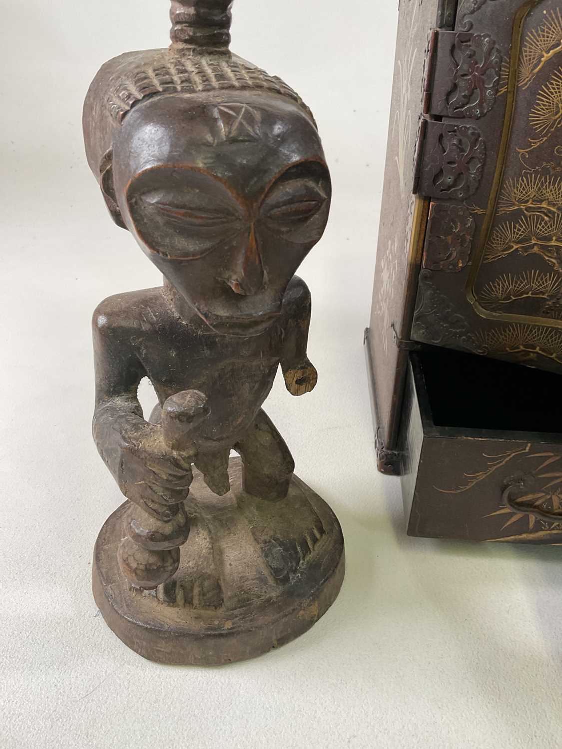 A Japanese table top cabinet and three wooden tribal fertility figures, (all in af condition), - Image 3 of 4