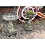 A composite stone bird table and sun dial, height approx 67cm.