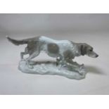 KARL ENS; a large porcelain figure of a dog, painted mark and incised number 2978 to base, length