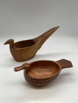A Scandinavian folk art treen bowl in the form of a duck, length 16.5cm, and a similar Yugoslavian