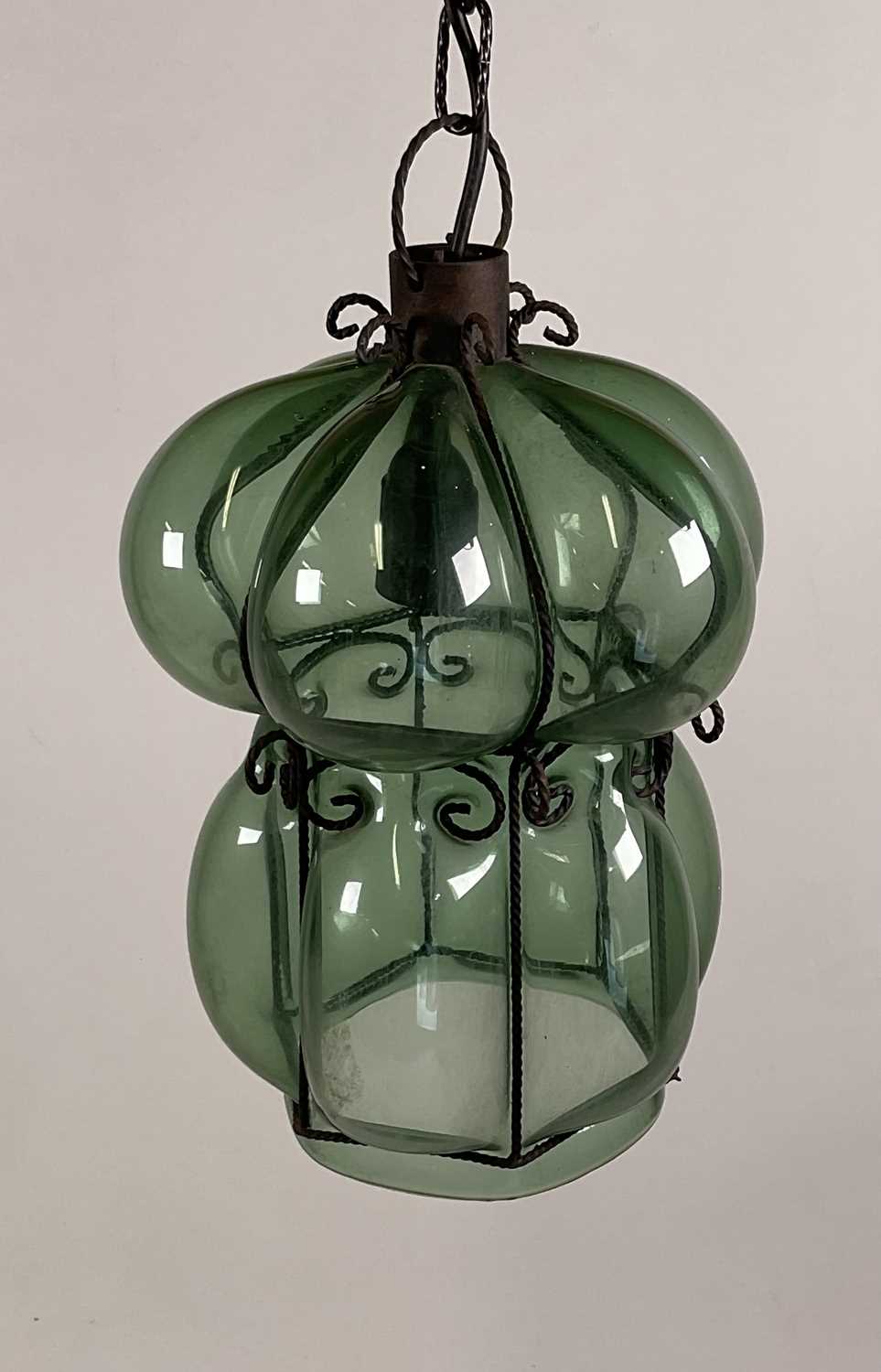 A Venetian glass, hand blown green bubble pendant light with metal framework. H: 34cm