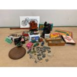 A quantity of vintage toys including diecast vehicles, lead animals, board games and other items