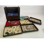 A large collection of costume jewellery in a travelling case including earrings, rings, brooches,