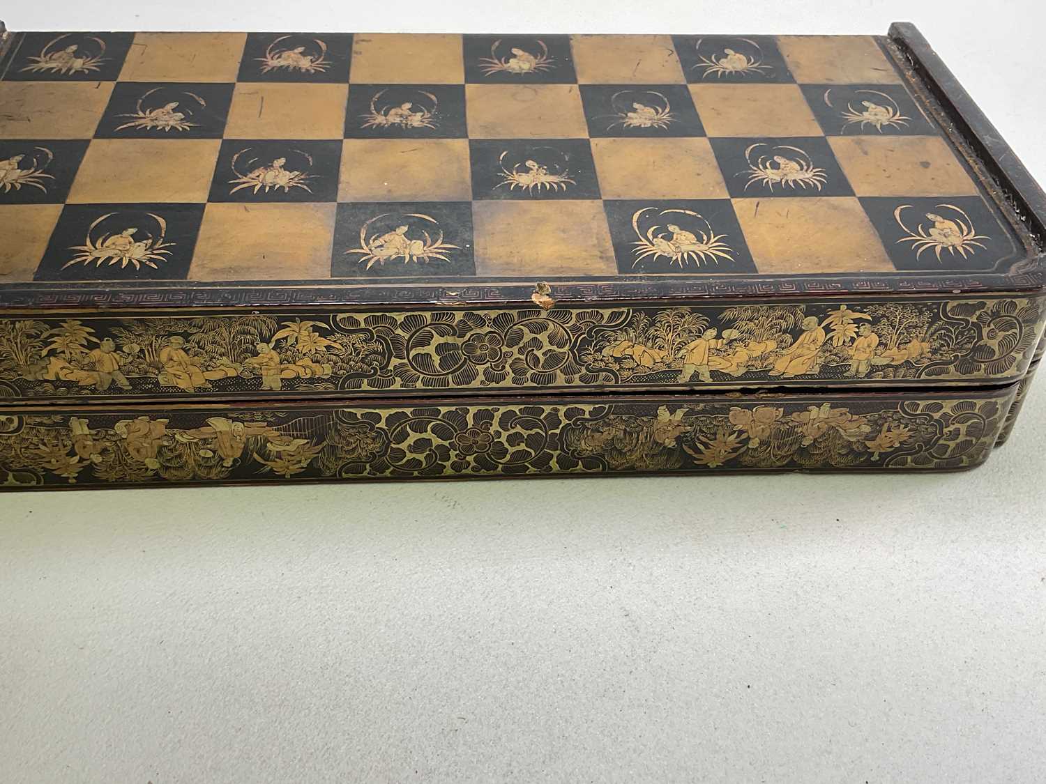 A 19th century lacquered Chinoiserie detailed folding games board, length 42cm (af). - Image 4 of 4