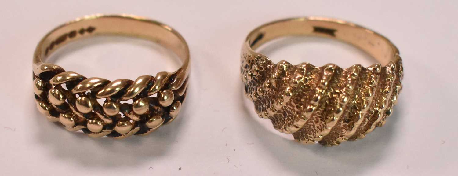 Two 9ct yellow gold rings with domed studded detail, sizes L and K, combined approx 5.9g (2).