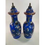 A very large pair of mid 19th century blue ground vases in the Chinoiserie style with stylised