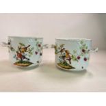 A large pair of circa 1900 German porcelain twin handled jardinières, each decorated with exotic