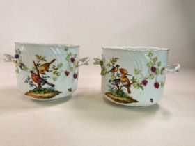 A large pair of circa 1900 German porcelain twin handled jardinières, each decorated with exotic