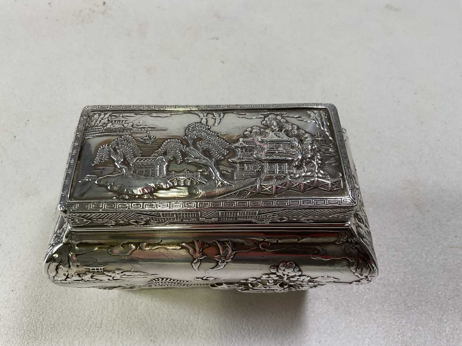 A circa 1900 Chinese white metal tea caddy with lift-off cover, inner liner and bombe body decorated - Image 2 of 4