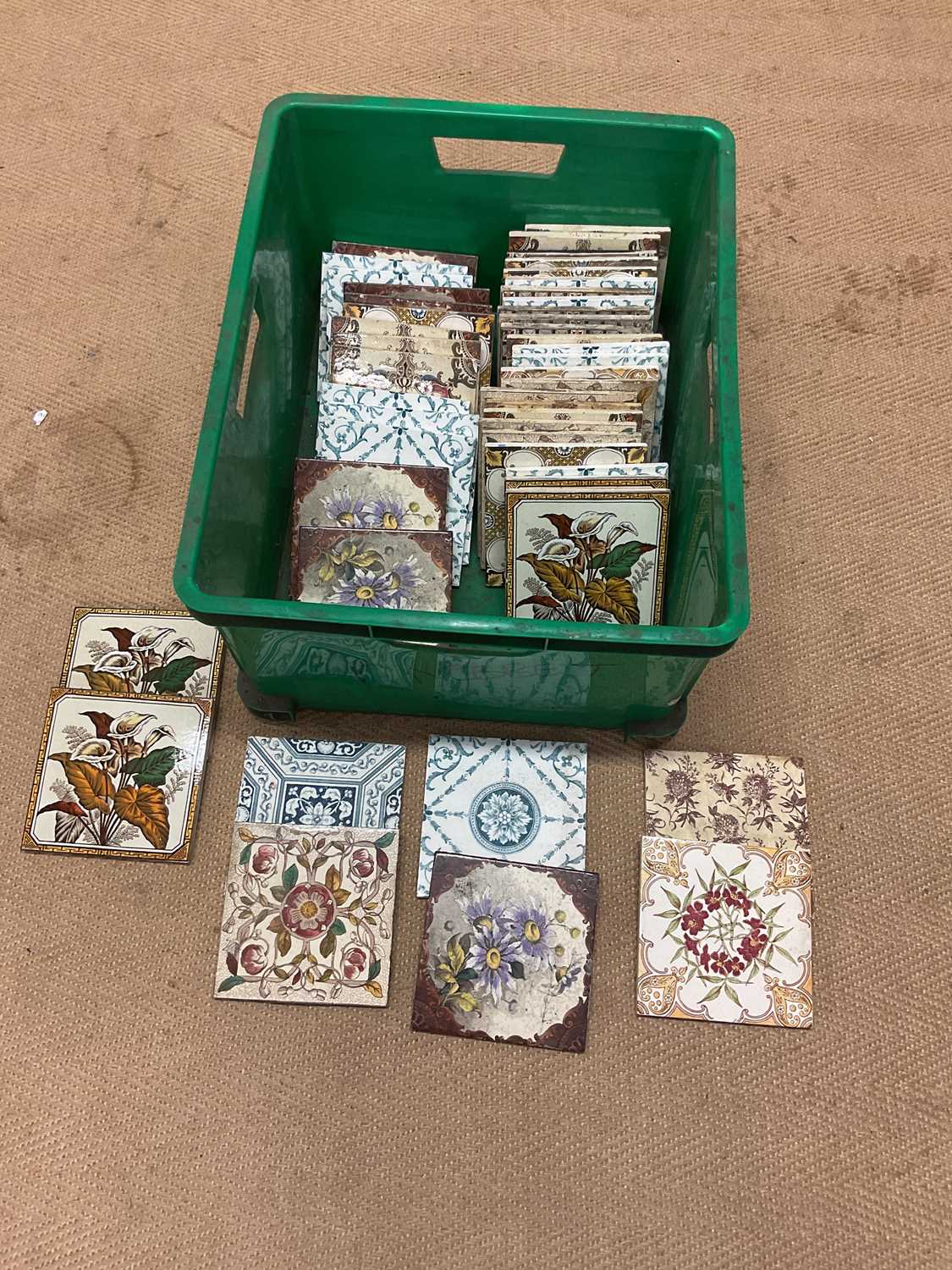 A quantity of 19th century tiles with various floral patterns, each 15.5 x 15.5cm.