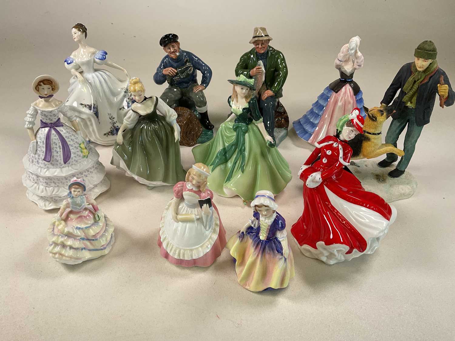 ROYAK DOULTON; eleven figures including HN3263 'Beatrice', HN2317 'The Lobster Man', HN2258 'A