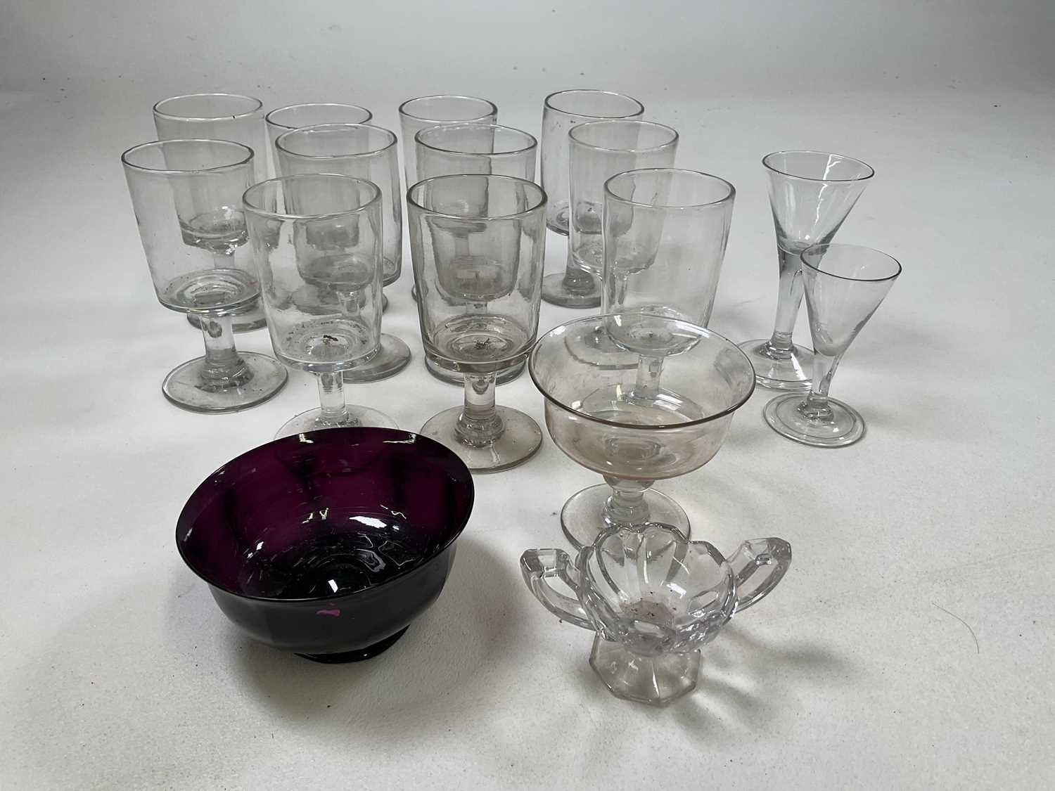 Eleven 19th century clear glass rummers, a sweetmeat bowl with knopped stem, two further glasses and