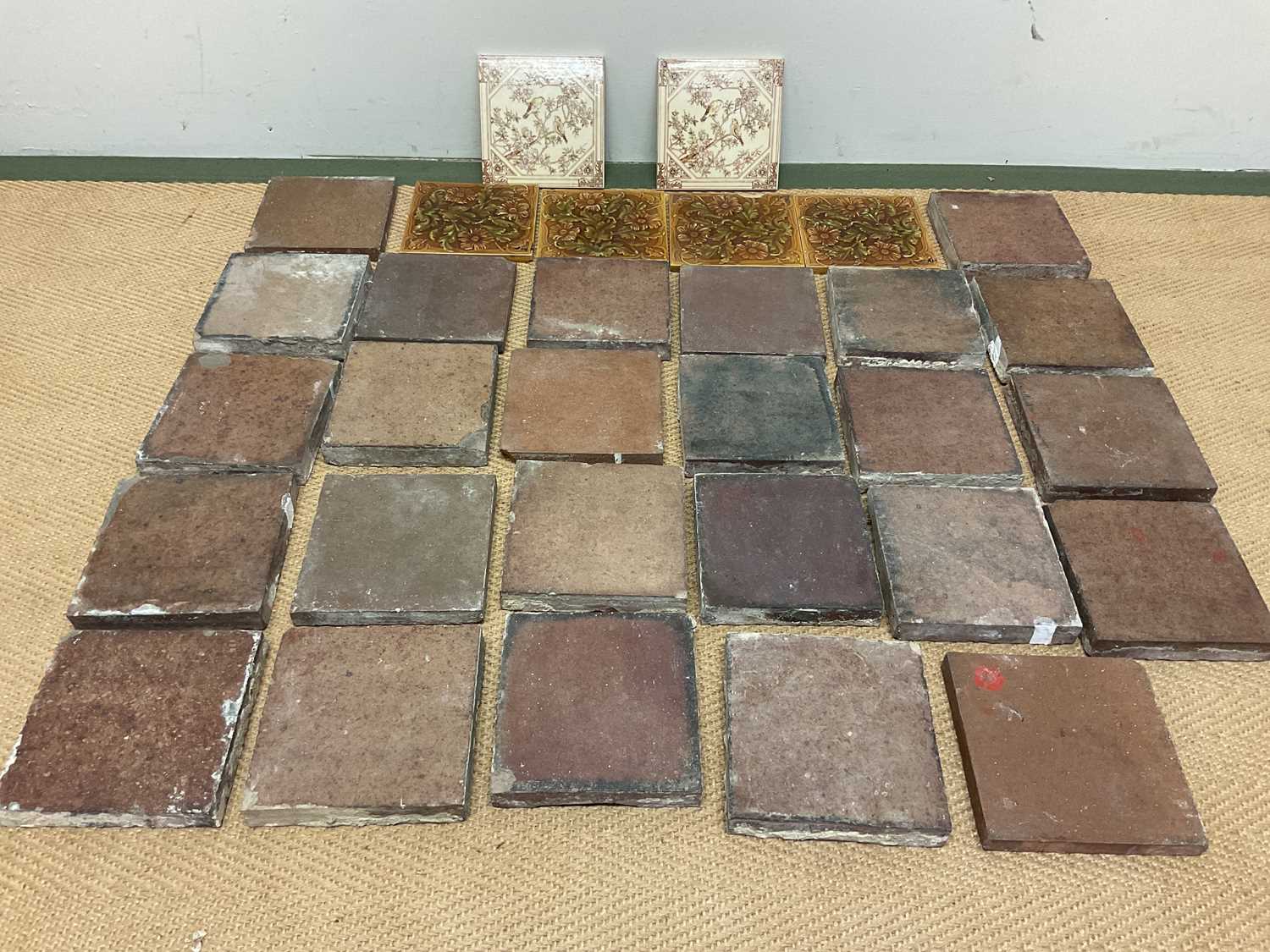 A quantity of tiles, six decorated, the rest plain, each approx 15 x 15cm.