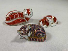 ROYAL CROWN DERBY; three paperweights to include a 'Puppy', exclusive for The Royal Crown Derby