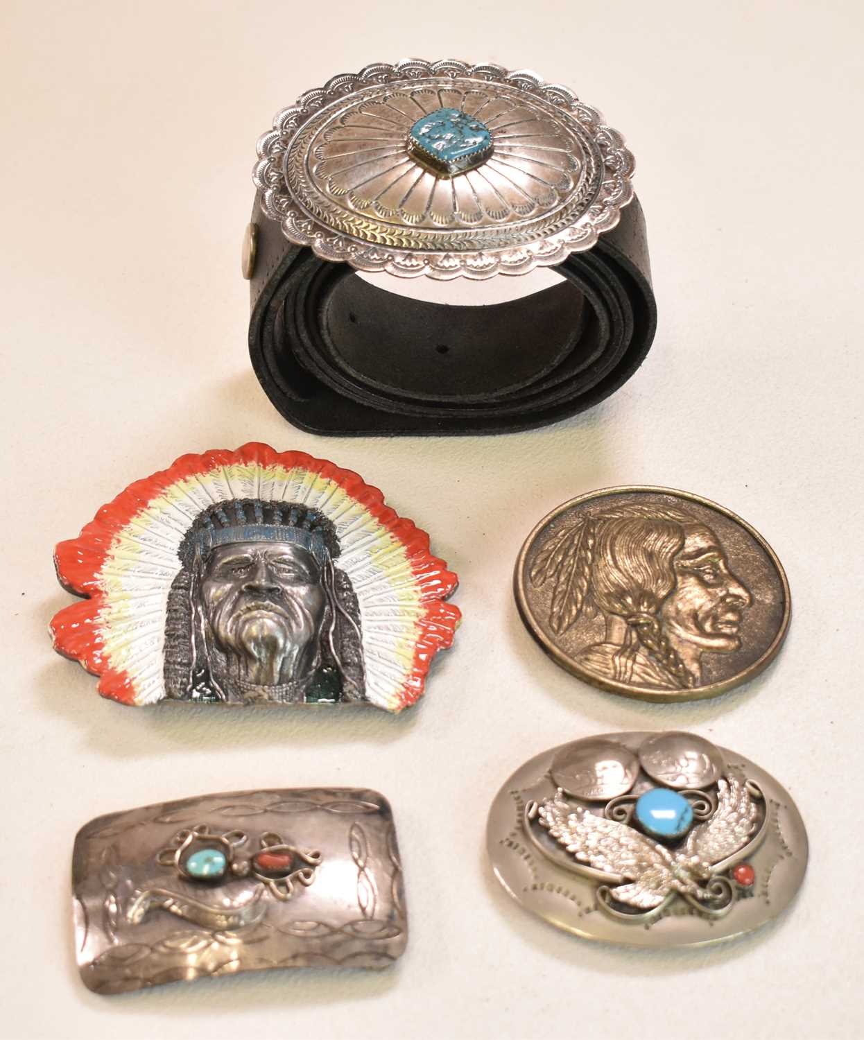 NAVAJO/NATIVE AMERICAN; three white metal belt buckles, each set with turquoise, and two modern