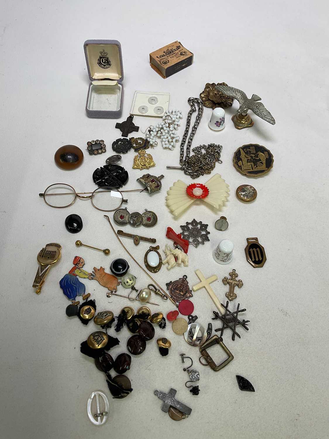 A collection of costume jewellery, buttons, spectacles and other items