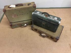 Four military suitcases comprising three canvas Naval style suitcases and one small metal example,