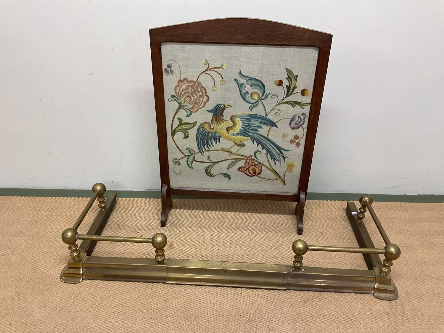 An extending brass fire fender and fire screen/guard with crewel work panel, 76 x 56cm.