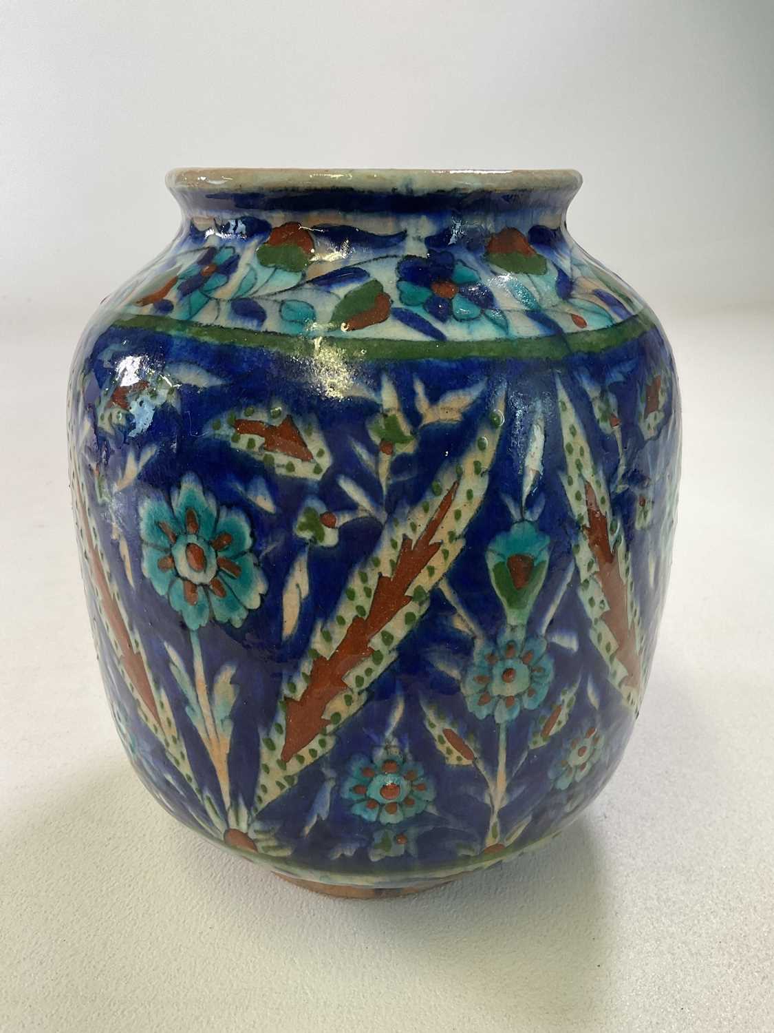 A Palestinian vase with floral and leaf decoration in shades of blue, turquoise, ochre and green, - Image 2 of 4