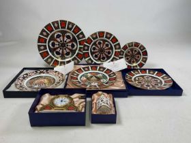 ROYAL CROWN DERBY; items in the Imari palette to include a clock, Christmas plates etc, some boxes