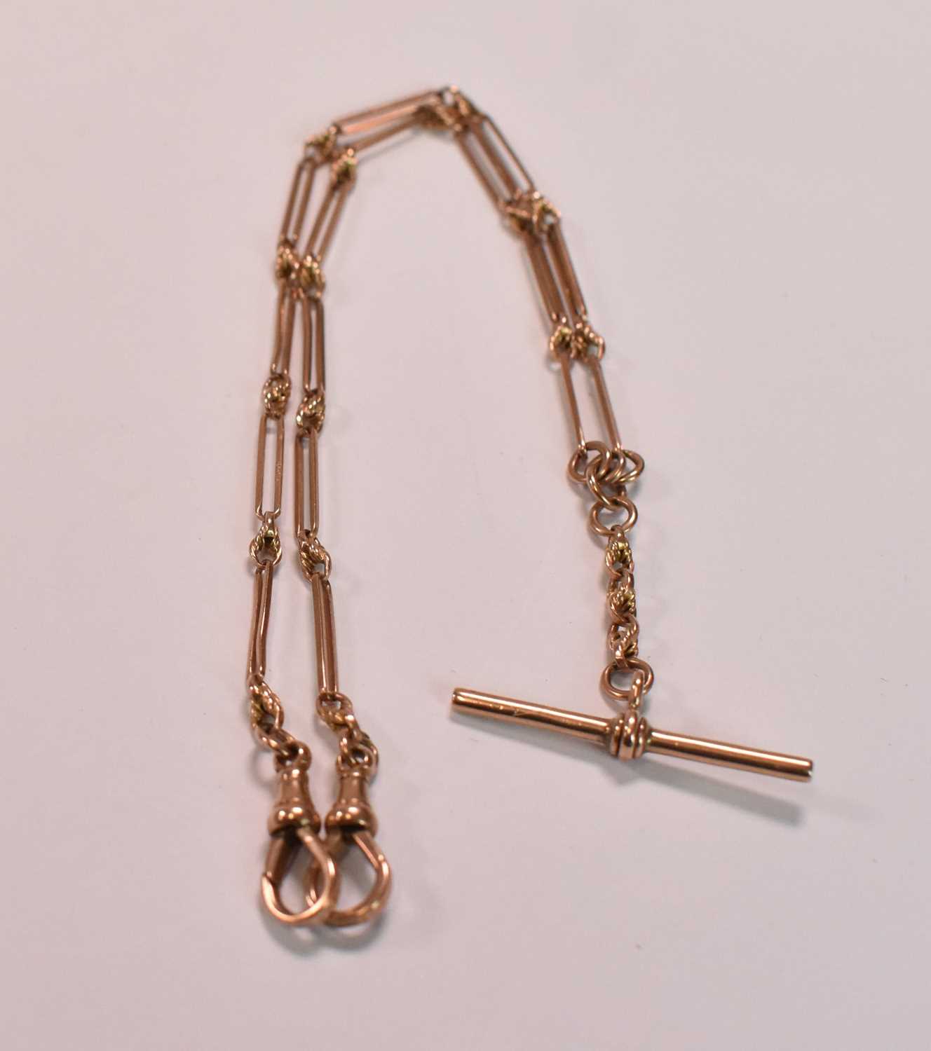 A 9ct rose gold Albert chain with T-bar and sprung end clasp, length 38cm. 12.2g approx Condition