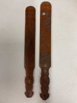 A pair of Japanese wooden page turners with carved motifs, one with inlaid with mother of pearl,