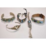 NAVAJO/NATIVE AMERICAN; a 925 grade silver bangle set with five rough cut polished pieces of