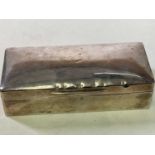 A George V hallmarked silver rectangular cigarette box, engraved with initials and bearing plaque