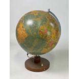 Mid 20th century German globe mounted on a circular teak base, height 45cm, width 30cm.