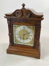 A large oak cased mantel clock, height 38cm.