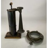 A Tyfon Patent hand operated fog horn, height 59cm, together with a ship's porthole, diameter