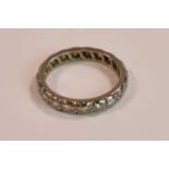 A white metal and diamond set full eternity ring, each round brilliant cut stone weighing approx 0.