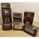 A collection of vintage valve radios including two bakelite, a large HMV and others (9)