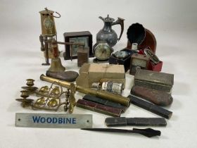 A collectors' lot including a pair of brass Art Nouveau wall mounted candleholders, powder flasks,