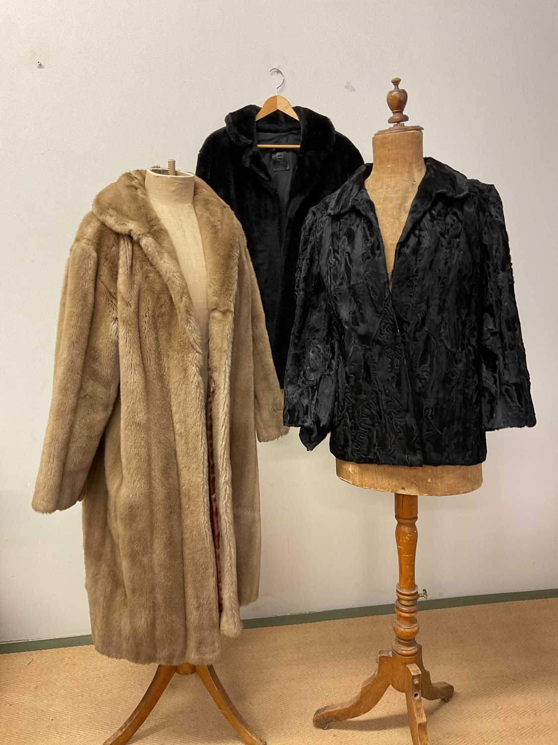 A vintage black lamb jacket with a faux jacket and coat