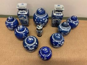 A group of eight early 20th century Chinese blue and white ginger jars and covers, height of largest