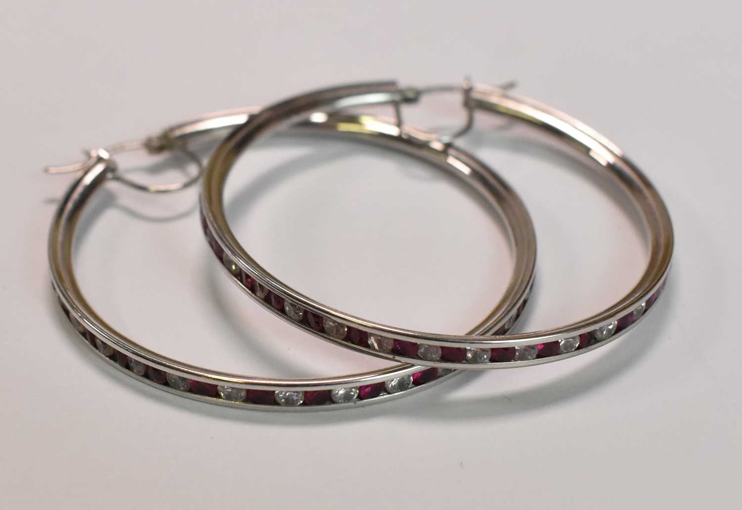 A pair of large 9ct white gold hoop earrings, combined approx 11.2g. Diameter 9.5cm