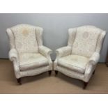 Two cream upholstered arm chairs, height 92cm, width 82cm. Condition Report: These are reproductions