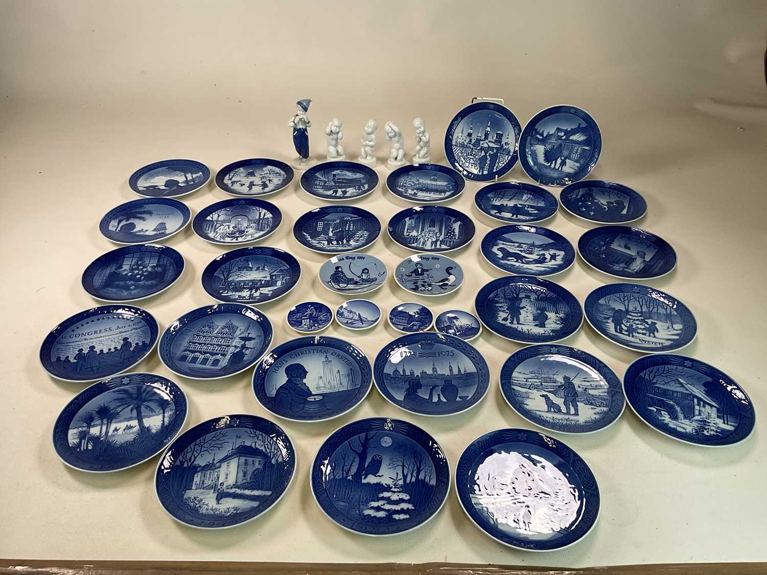 ROYAL COPENHAGEN; a quantity of collectors' plates (34) and five child figures.