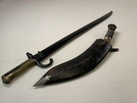 A French chassepot bayonnet, length 71cm and a Gurkha's kukri knife with horn handle, length 43cm (
