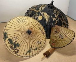 An impressive Chinese parasol decorated with trees and birds in gold with pink border, diameter