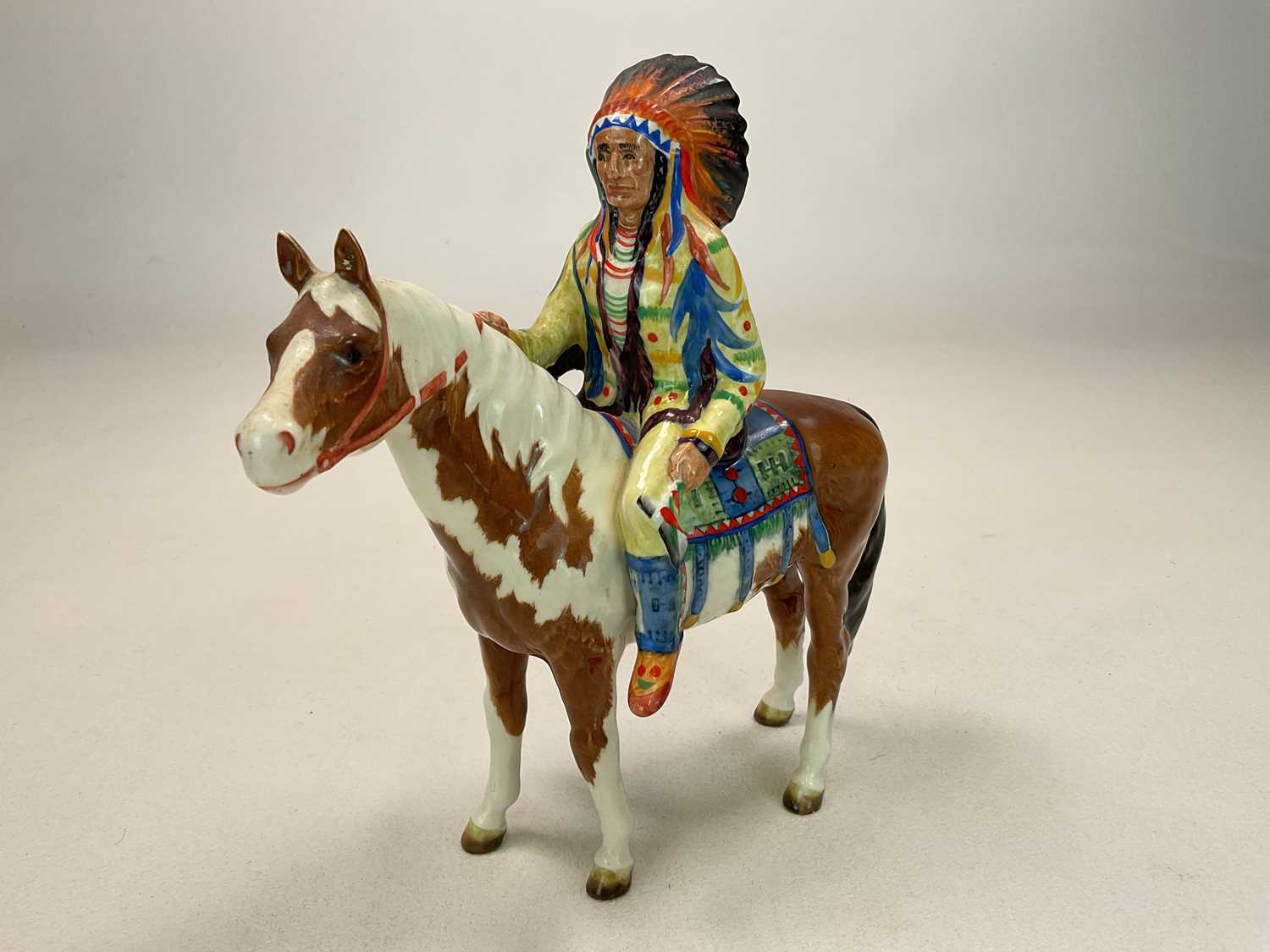 BESWICK; a mounted Native American on skewbald horse, model 1391, gloss finish, black Beswick