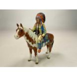 BESWICK; a mounted Native American on skewbald horse, model 1391, gloss finish, black Beswick