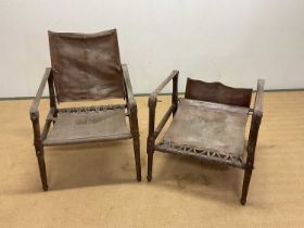 A pair of mid 20th century safari chairs constructed of leather and stained beech. Condition Report: