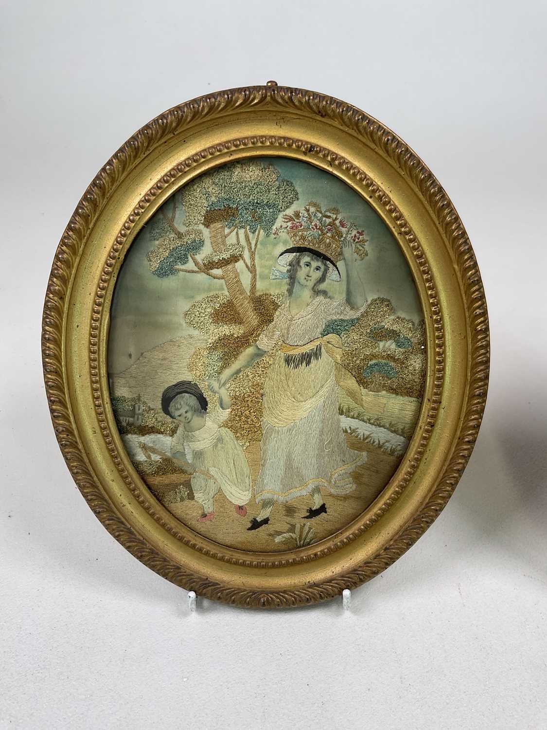 A pair of Georgian oval silk work embroideries in gilt frames, with two miniatures, a - Image 2 of 7